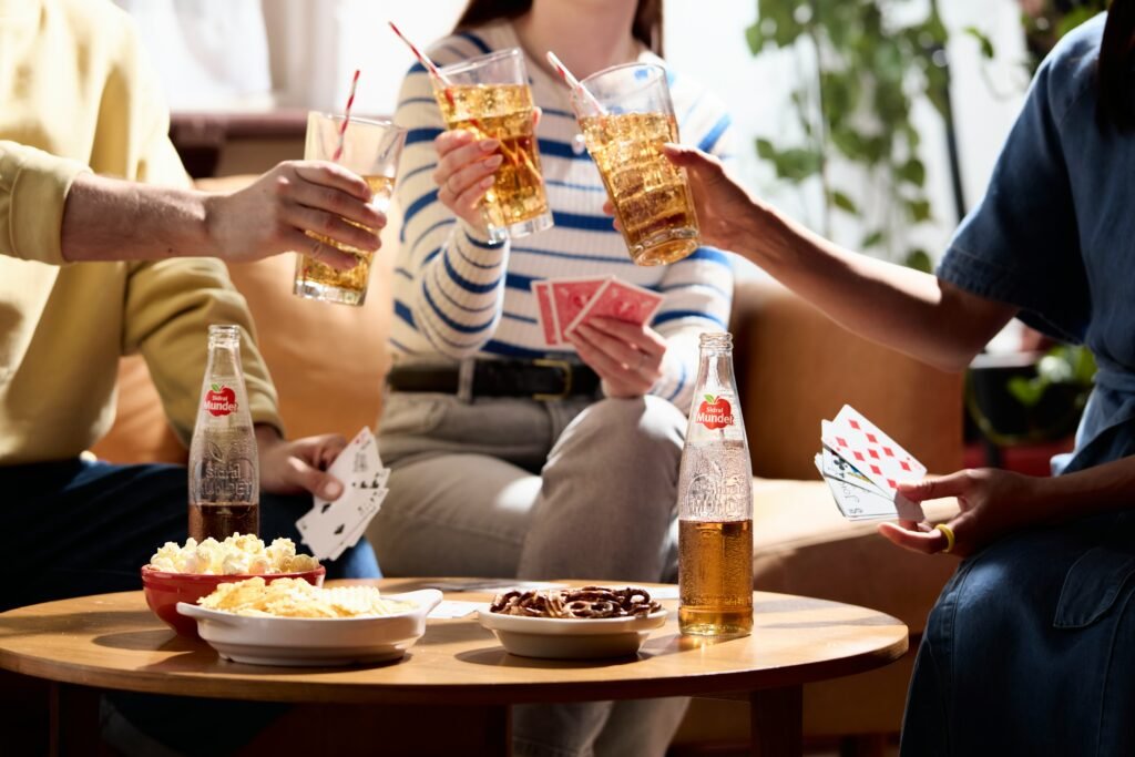 people playing cards and cheering